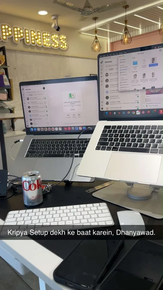 Two MacBooks side by side on a desk